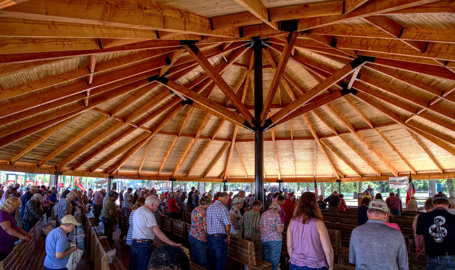 Attendees at the annual Wood County Electric Co-op meeting Friday pause for a prayer. It was the first community gathering held in the newly-reconstructed pavilion at Jim Hogg City Park in Quitman.